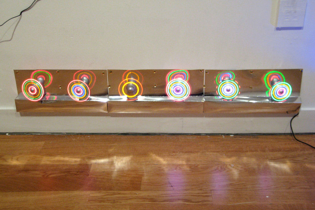 detail: found LED fans, mirror foil paper, electrical components, 39 x
		  6.25 x 1.25 inches / 99 x 16 x 3 cm