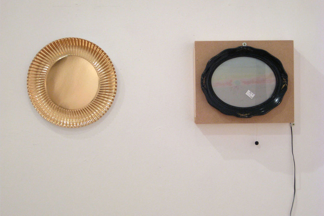 Pounds of Happiness (installation), 2009, found paper plate,
            found frame, modified solar powered light, wood, paper, plastic,
          58 x 65 x 2 inches / 147 x 165 x 5 cm