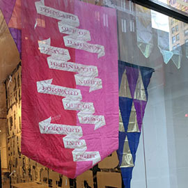 banners and flags in a storefront window