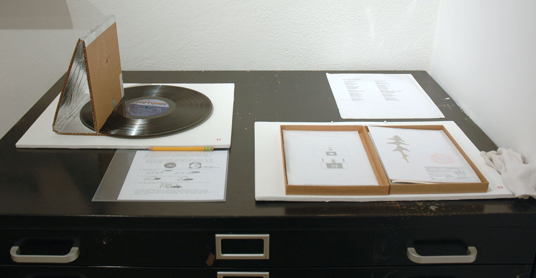 N. Sean Glover, Record Player in an Envelope, 2009, media mixed, roughly 8×11 inches / 203×279 mm / Pest (Rebecca Chesney, Robina Llewellyn & Elaine Speight), Pest Limited Edition Box Set, 2009, Media Mixed, 6.7×9.25×0.8 inches / 17×23.5×2 cm
