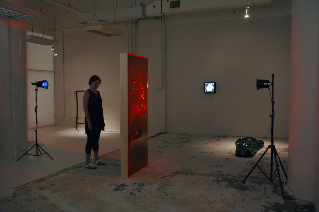 Doorway (interaction view), 2014, wood, vinyl, asphalt-based coating, lights, stands, gels, door: 82.5 x 33.5 x 5.5 inches / 210 x 85 x 14 cm