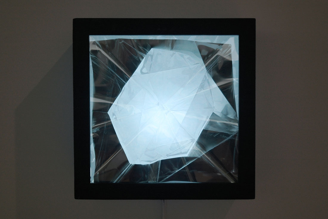 Mirror #2, 2014, 13.625 x 13.625 x 5.5 inches / 34.6 x 34.6 x 14 cm, wood, asphalt-based coating, light, acrylic, Mylar, window tint
