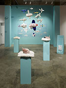 an installation of stuffed airplanes made with soft velvet