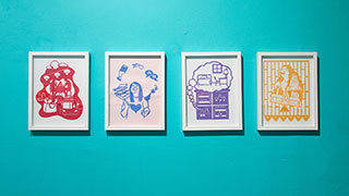 A row of 4 papercuts framed in white frames.