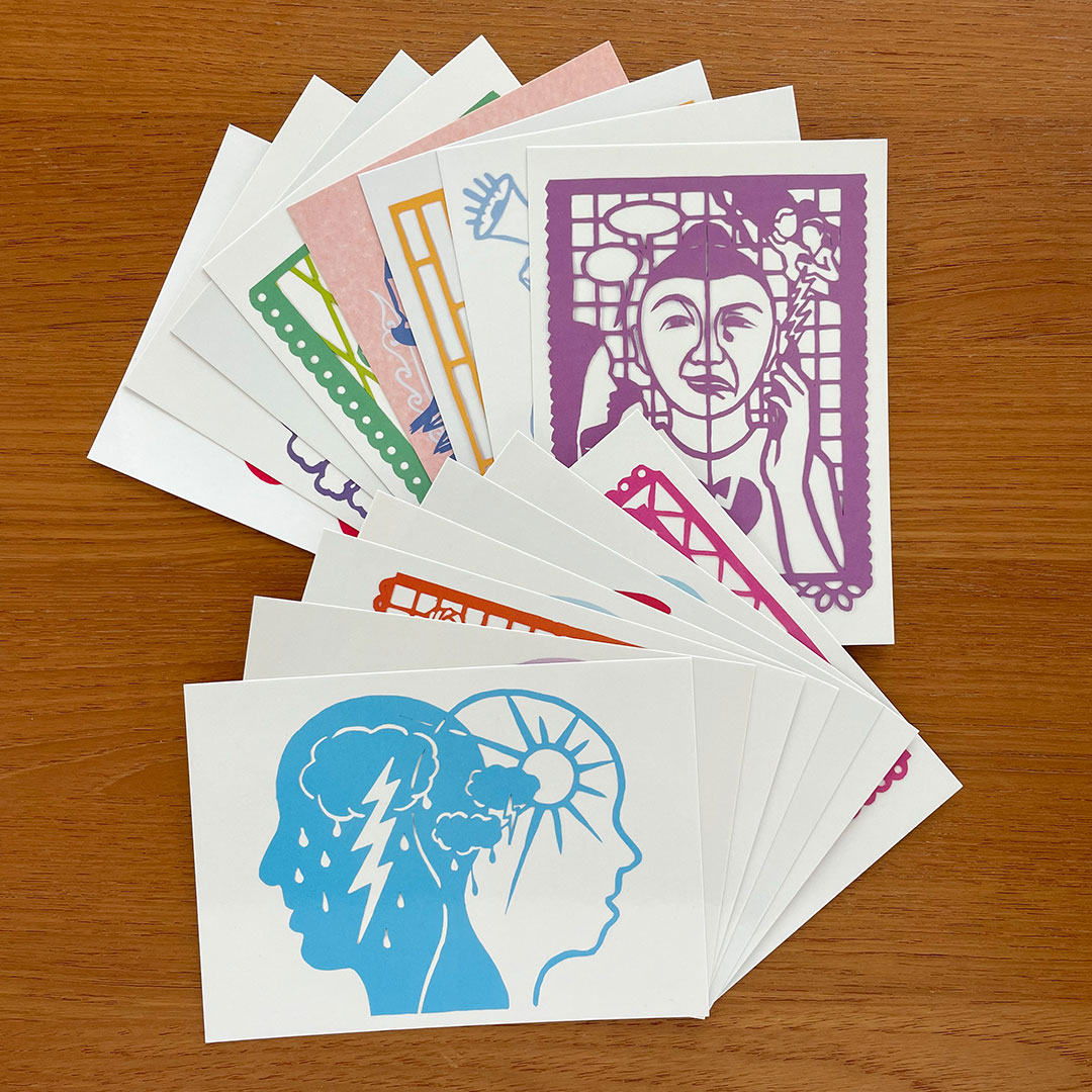 Set of 20 postcards with various colored papercuts on them