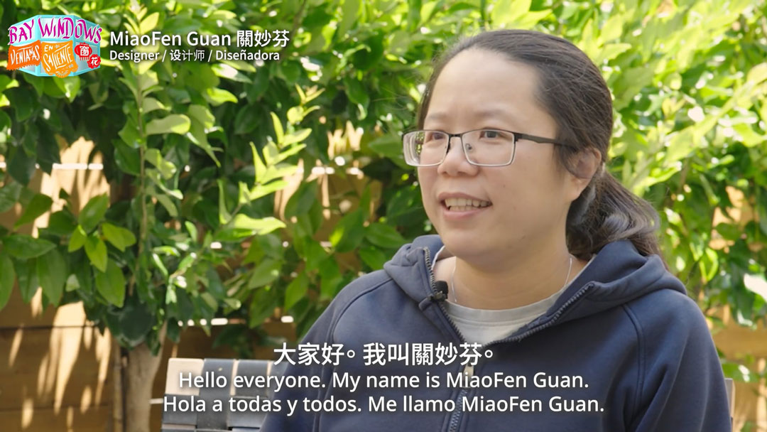 still of trilingually subtitled video interview with a woman, available at the link