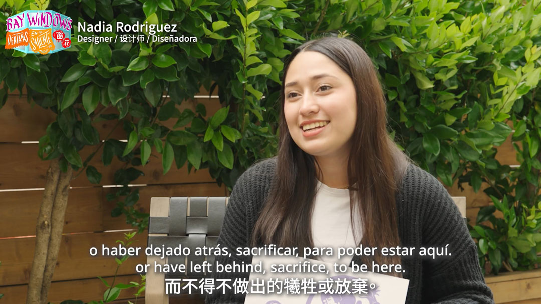 still of trilingually subtitled video interview with a woman, available at the link