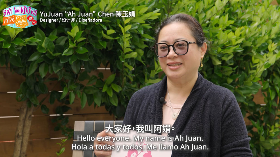 still of trilingually subtitled video interview with a woman, available at the link